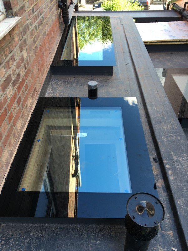 Multiple flat roof skylights on extension in Acton